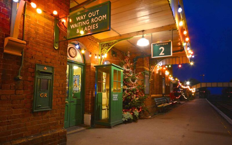 Watercress Line station decorated with Christmas lights